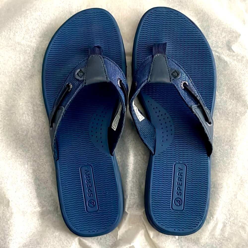 Flip flops in a bright navy blue color.